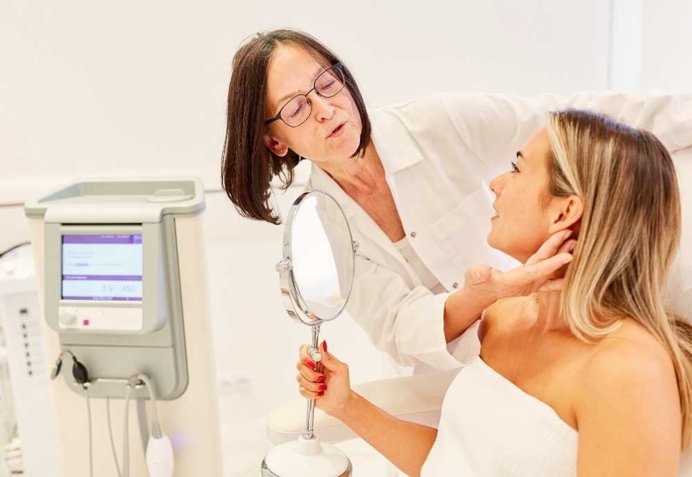 Dermatologist working with woman, acne after menopause