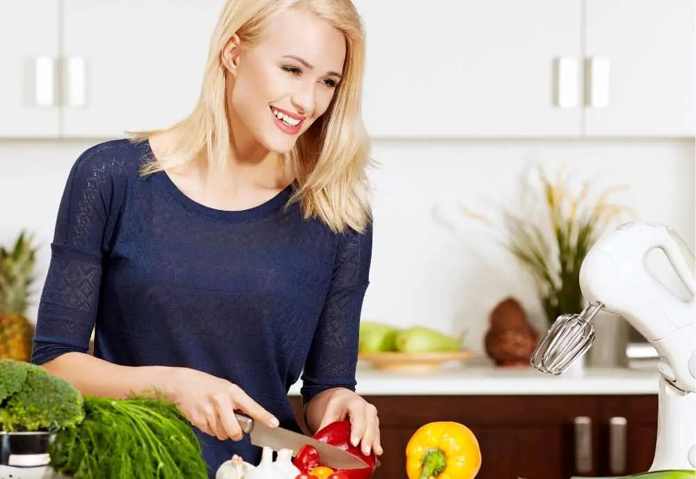 woman preparing healthy food in kitchen